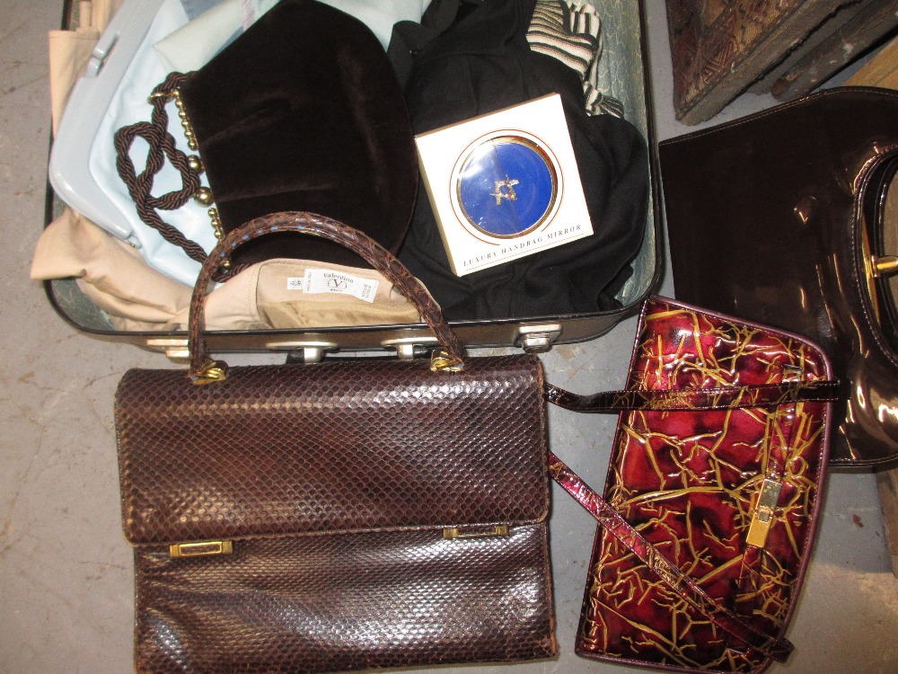 Small case containing a quantity of clothes by Valentino and Mulberry together with various