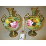 Pair of Royal Worcester two handled baluster form hand painted floral decorated vases, signed F.J.