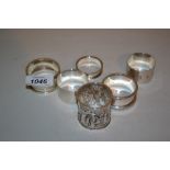 Victorian silver napkin ring with continuous band of embossed decoration,