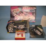 Two boxed scale model racing cars together with a boxed Hornby bridge and a boxed pinball machine