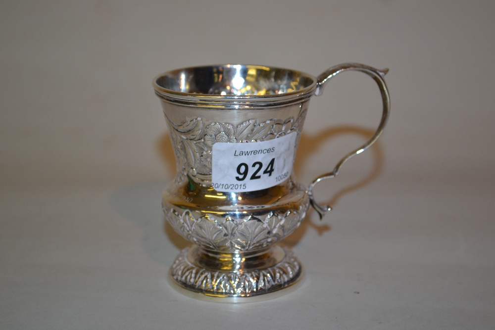 George IV Irish silver Christening mug of embossed knopped baluster form with scroll handle,