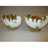 Pair of Coalport white glazed and gilded shell form dishes on naturalistic coral bases