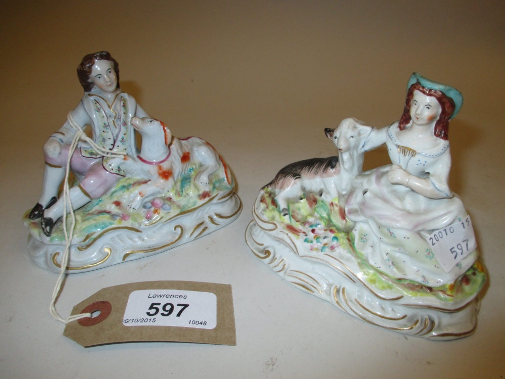 Pair of 19th Century Staffordshire pottery groups,