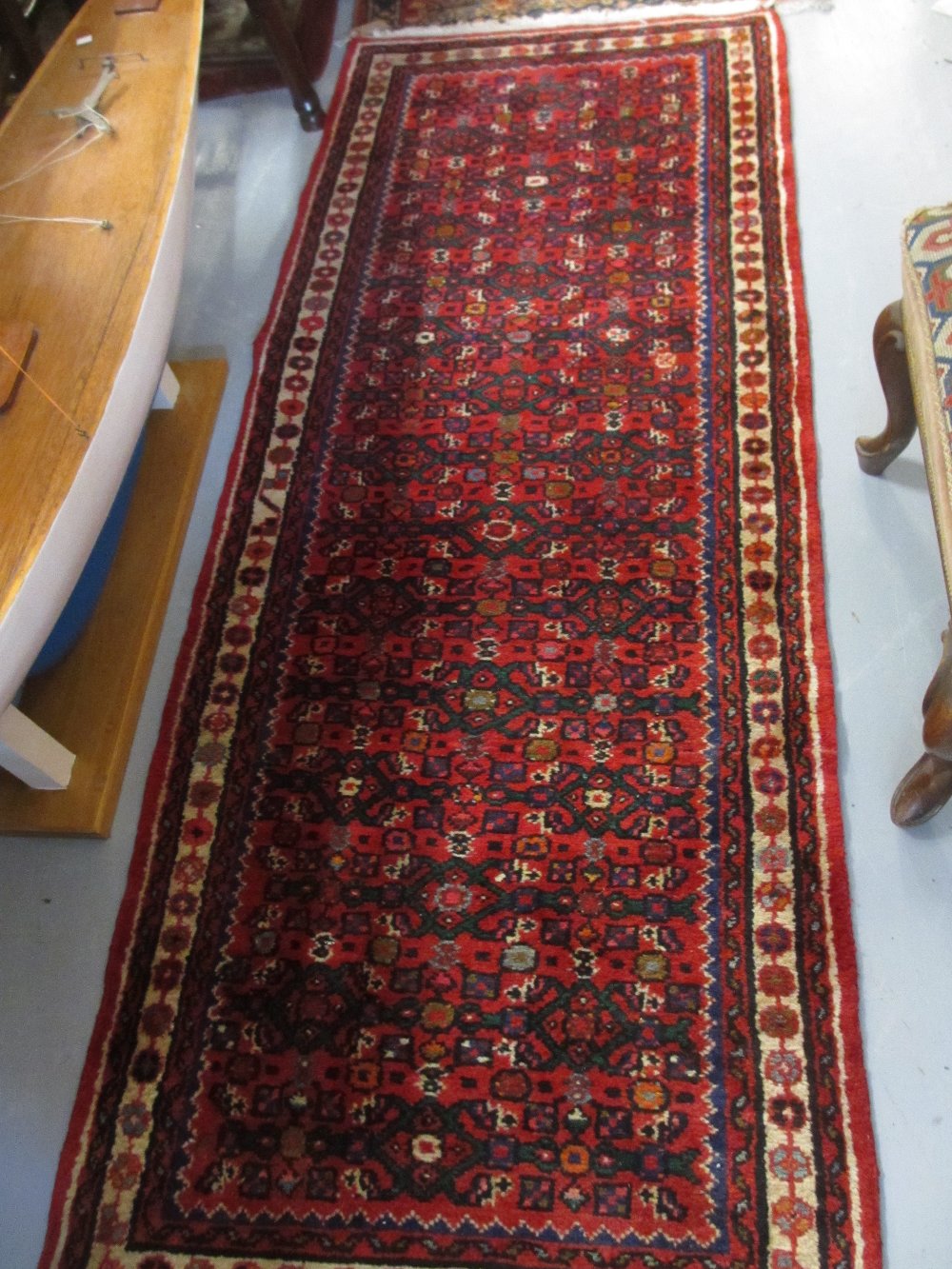 20th Century Hamadan runner with all-over Herati design on a red ground with borders