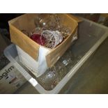 Box containing a quantity of various cut glass decanters, vases,