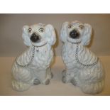 Pair of late Staffordshire figures of dogs,