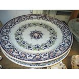 Pair of large 20th Century Continental circular pottery wall plates with floral decoration together