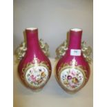 Pair of late 19th or early 20th Century baluster form vases with dragon side handles,