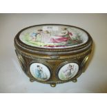 19th Century French gilt brass oval box and cover inset with porcelain panels depicting classical