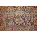 Small Belouch rug having red and blue ground with borders (worn)