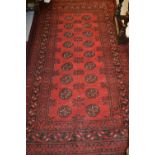 Afghan style rug having red ground, 1.92m x 1.