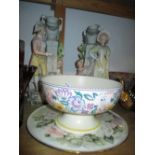 Poole pottery floral decorated pedestal bowl together with a circular rose painted plate and a pair