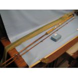 Milwards two piece cane fishing rod in slip case together with an early fly box with original label