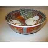 20th Century Imari bowl decorated with landscape and panel designs in red, blue and gold,