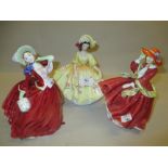 Group of three Royal Doulton figures, ' Top o' the Hill ' HN1834, monogrammed P.T.