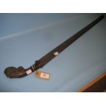 Antique steel sword with a floral carved rhinoceros horn grip,