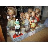 Quantity of various Hummel figures of children