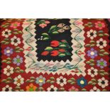 Two flat weave rugs of floral design