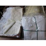 Two pairs of white cotton single sheets together with a quantity of embroidered and crochet trimmed