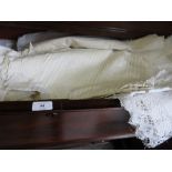 Quantity of childrens embroidered and lace work gowns and other textiles