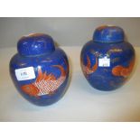 Pair of Chinese porcelain ginger jars decorated with fishes in iron red and gilt on a mottled blue