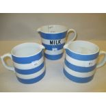 Group of three Chinese blue and white jugs together with a pottery mantel clock