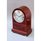 A MAHOGANY MANTEL CLOCK dial silvered, movement striking on a bell, case fiddle back top and