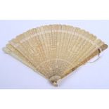 A CHINESE BRISE IVORY FAN Guards carved with birds & flowers, sticks carved with flowers and