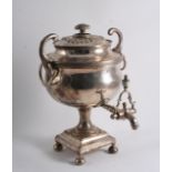 A SMALL EARLY 19TH CENTURY PLATED TEA URN on a square pedestal base with button feet, upswept