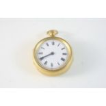 A GILT METAL OPEN FACED POCKET WATCH the white enamel dial with Roman numerals, with a compass set