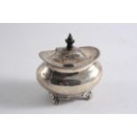 A LATE VICTORIAN TEA CADDY of bellied oval form on four scroll & paw feet, domed cover & gadrooned