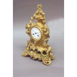 A NEO ROCOCO ORMOLU MANTEL CLOCK dial white enamel, movement drum striking on a bell, the vigorous