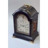 AN EBONISED MANTEL CLOCK dial silvered, signed Webster, London, strike/silent dial to the arch,