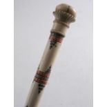 AN INDIAN IVORY CANE with carved top & red and black incised decoration;  102 cms