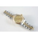 A LADY'S STAINLESS STEEL AND GOLD OYSTER PERPETUAL WRISTWATCH BY ROLEX the signed gold coloured dial