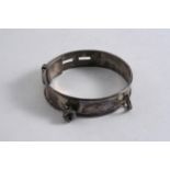 A LATE VICTORIAN SMALL, ADJUSTABLE DOG COLLAR with a single bell dependant, by L. Emmanuel,