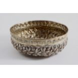 AN INTERESTING ANTIQUE PARCELGILT DRINKING BOWL with a reeded rim, now with later embossed