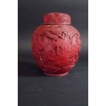 A CINNABAR LACQUER JAR AND COVER the ovoid body carved in low relief with figures in a mountainous