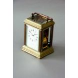 A CARRIAGE CLOCK dial white enamel, signed Clarke, movement repeating, lever escapement, striking on