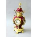 AN ART NOUVEAU STYLE GILT METAL MOUNTED MANTEL CLOCK dial cream enamel, movement drum, striking on a