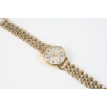 A LADY'S 9CT. GOLD WRISTWATCH BY OMEGA the signed circular dial with baton numerals, on a gold