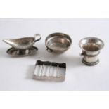 MINIATURES OR TOYS: A Dutch sauceboat with an integral stand, a Dutch pestle, a Dutch grille & a