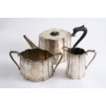 A VICTORIAN ENGRAVED THREE-PIECE TEA SET with shaped & tapering oval bodies, by Messrs. Barnard,