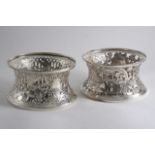 TWO MODERN IRISH DISH RINGS IN THE 18TH CENTURY STYLE One pierced & embossed with birds & fruit