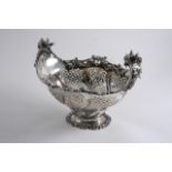 AN EDWARDIAN OVAL BASKET with upswept handles, decorated with China-man masks, flowers & scrolls,