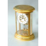 AN ORMOLU OVAL FOUR GLASS MANTEL CLOCK dial white enamel, movement exposed escapement with