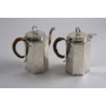 A MODERN OCTAGONAL SMALL COFFEE POT & MATCHING HOT MILK JUG with cane-insulated handles & ring