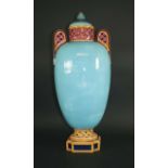 LARGE MAJOLICA VASE with a domed top cover and pierced handles, and with a turquoise body. Some