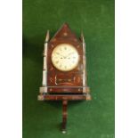A ROSEWOOD BRACKET CLOCK AND BRACKET dial cream painted, movement striking on a gong, case of Gothic