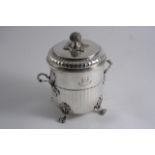 AN EDWARDIAN CIRCULAR BISCUIT BOX & COVER with a bud finial & four leaf & scroll feet, the body with
